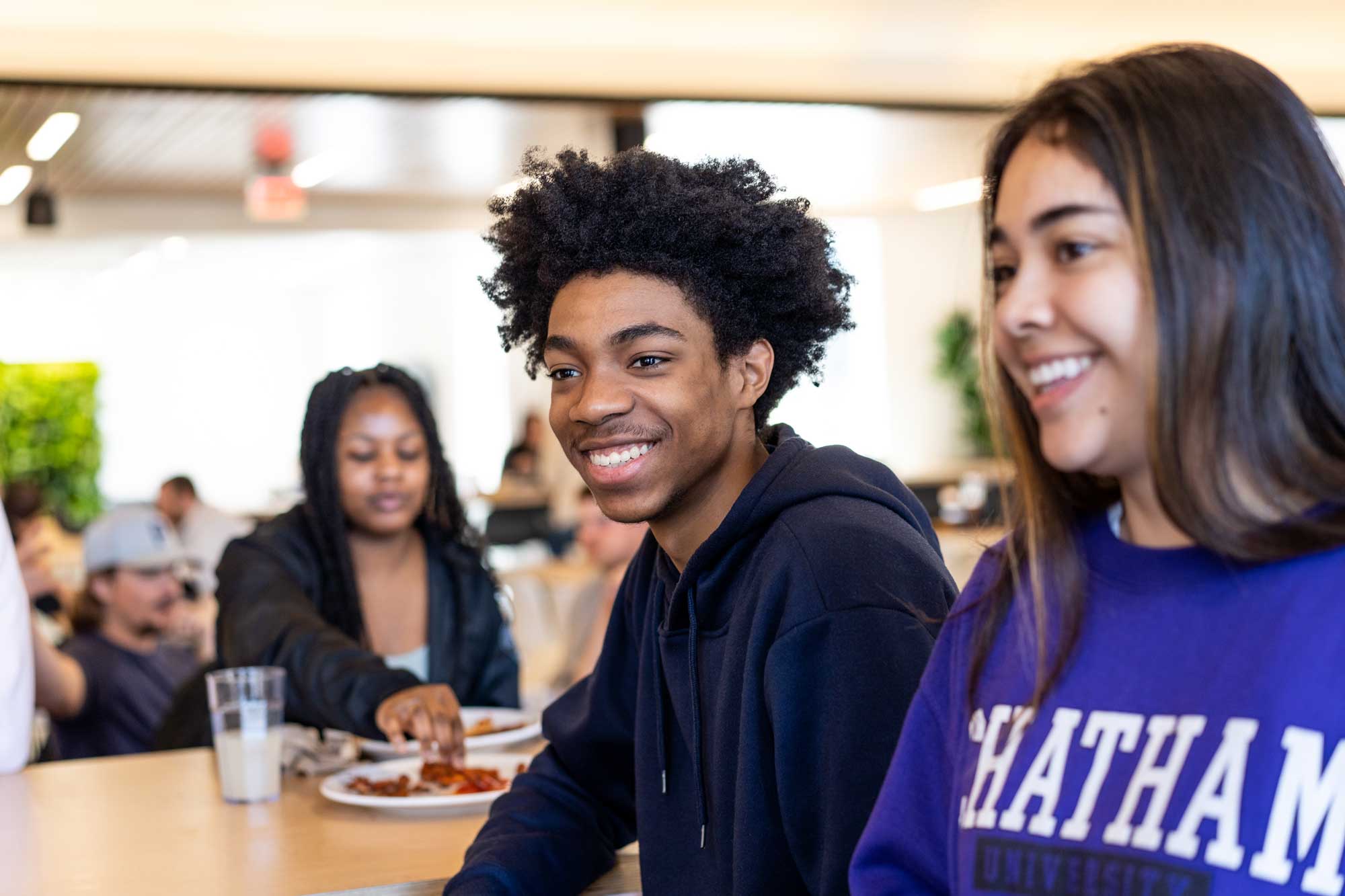 two students in a dining hall at Chatham